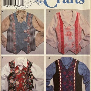 May include: A Simplicity Crafts sewing pattern envelope 7231 for vests in sizes XS, S, M, L, XL. The front displays four variations of sleeveless vests worn over long-sleeved shirts, featuring different floral, plaid, and solid fabric designs.