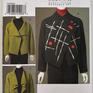 May include: A sewing pattern envelope labeled V8430 Marcy Tilton Wearable Art. It displays two jacket designs: a solid olive green jacket with a wide collar and a black jacket featuring white cross-hatch embroidery and three circular red accents.