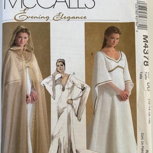 May include: A McCall's Evening Elegance sewing pattern envelope M4378 featuring illustrations of a hooded cloak and two long dresses with gold trim. The white paper envelope displays the brand name, model number, and size range 12-14-16-18.