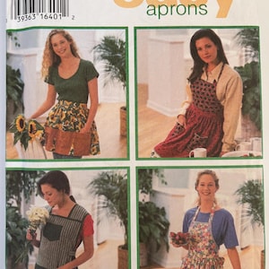 May include: A Simplicity sewing pattern envelope labeled 9333 design your own easy aprons. The front displays four photographs of various apron styles, including sunflower, floral, and striped patterns with pockets, in sizes S, M, and L.