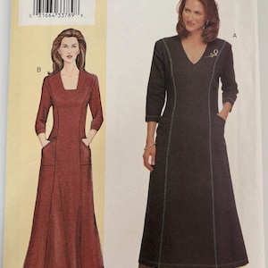 May include: A Today's Fit by Sandra Betzina sewing pattern envelope 7472 featuring two dress designs. View A is a black V-neck dress with white topstitching and pockets. View B is a rust-colored square-neck dress with pockets and three-quarter sleeves.