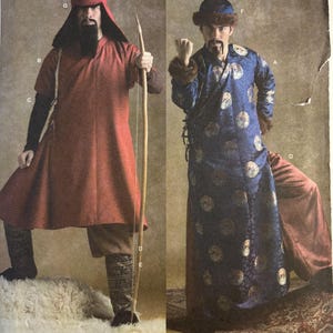 May include: Simplicity sewing pattern 3772, size AA 38, 40, 42, 44. The envelope displays two costume variations: a red tunic with a hood and bow, and a blue patterned robe with fur-trimmed hat and cuffs, both featuring long sleeves and trousers.