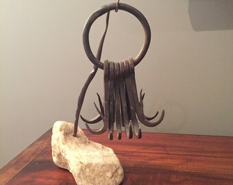 Old Whaling hooks on stone block