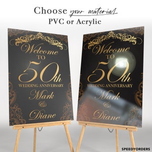 May include: Two rectangular wedding anniversary signs on wooden easels. The signs feature a black background with gold ornate scrollwork borders and gold text reading Welcome to 50th Wedding Anniversary Mark & Diane. Text above reads Choose your material PVC or Acrylic.