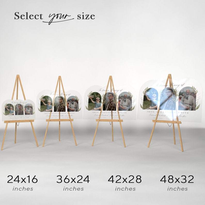 May include: Four different sizes of clear acrylic memorial signs with a photo collage and greenery design. The signs are displayed on wooden easels. The sizes are 24x16 inches, 36x24 inches, 42x28 inches, and 48x32 inches.