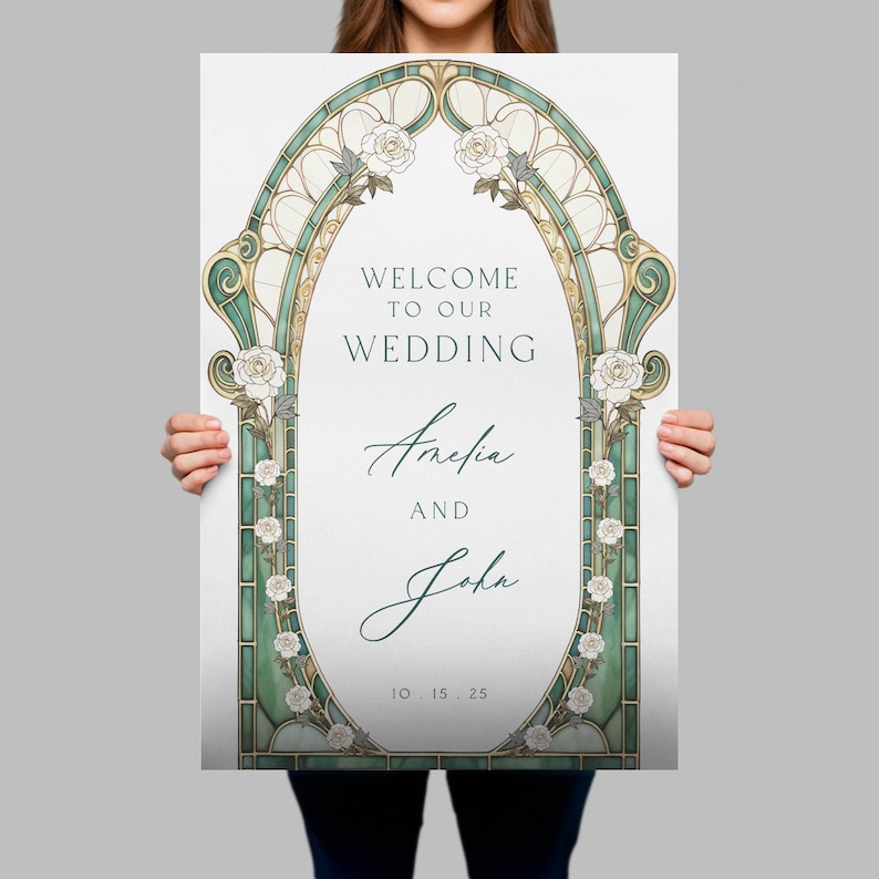 May include: A rectangular wedding welcome sign featuring an oval frame with green stained glass patterns and white rose illustrations. The text reads: WELCOME TO OUR WEDDING, Amelia AND John, 10 . 15 . 25. The design uses dark green and gold accents.