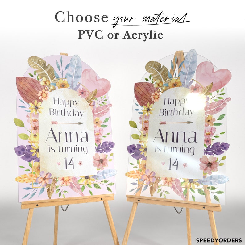 May include: Two arched birthday signs on wooden easels, one PVC and one acrylic. Both feature floral and feather illustrations, the text "Happy Birthday Anna is turning 14", and a central arrow. The top text reads "Choose your material PVC or Acrylic".