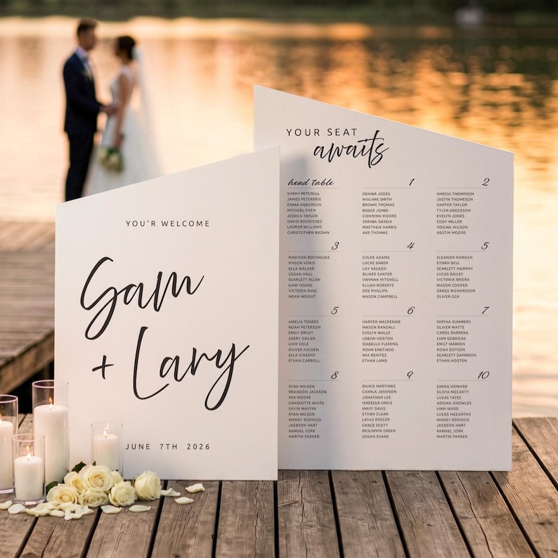 K&ouml;nnte beinhalten: Wei&szlig;e Hochzeits-Sitzordnung mit den Namen "Gam + Lary" und dem Datum "7. Juni 2026". Die Tafel enth&auml;lt G&auml;stenamen und Tischnummern. Der Hintergrund zeigt einen See und ein Paar.
