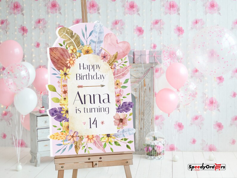 May include: A rectangular birthday sign with an arched top, featuring a light pink background decorated with watercolor flowers, leaves, and feathers. The text reads: Happy Birthday Anna is turning 14, accented by a small arrow and heart icons.