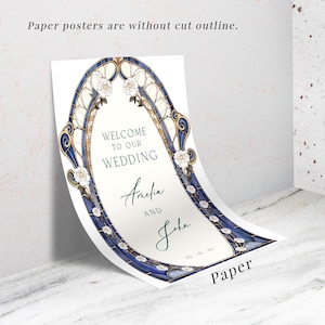 May include: A white paper wedding sign with a blue and gold arched border, featuring the text "WELCOME TO OUR WEDDING" and the names "Amelia AND John". The sign also includes the date "10-15-25" and the word "Paper".