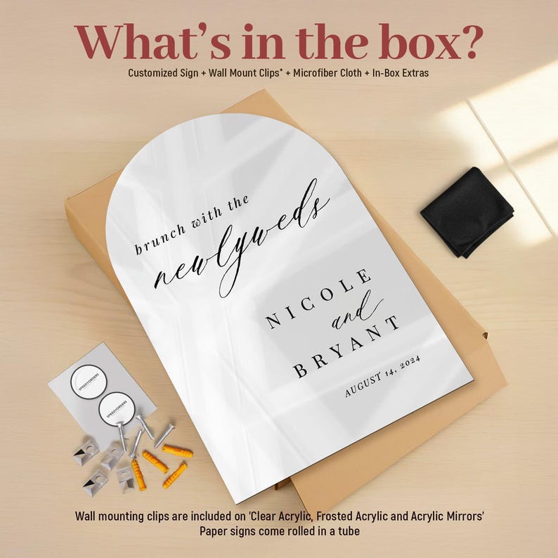 May include: An arched white acrylic sign with black text reading "brunch with the newlyweds," "NICOLE and BRYANT," and "AUGUST 14, 2024." The set includes metal wall mount clips, yellow wall anchors, and a black microfiber cloth in a box.
