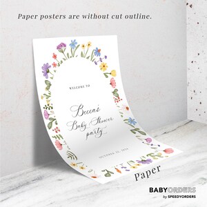 May include: A white paper poster featuring a colorful watercolor floral arch border. The text reads: Welcome to Becca's Baby Shower party, October 22, 2024. The poster has a curved top edge and is displayed against a wall. Paper posters are without cut outline.