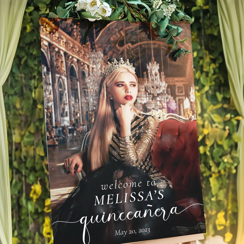 May include: A welcome sign for a quincea&ntilde;era, featuring a photo of a young woman wearing a crown and a sparkly dress. The sign is decorated with a white script font that says "welcome to Melissa's quincea&ntilde;era" and the date "May 20, 2023".