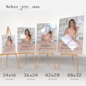 May include: Four different sizes of a quincea&ntilde;era sign with a photo of a young woman in a pink dress. The sign says "Welcome to Alexandria's Quincea&ntilde;era" with the date "02.11.2023". The sizes are 61x41 cm, 91x61 cm, 107x71 cm, and 122x81 cm.