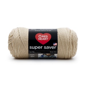 May include: A beige yarn ball with a black label featuring the text "RED HEART Super Saver" and a red heart logo. The label also includes the American flag and yarn weight information: 7 oz / 198 g.
