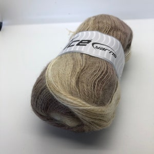 May include: A skein of brown and beige yarn with a white label that says "Ice Yarns".
