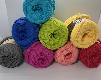 May include: A collection of colorful yarn skeins in various shades, including teal, blue, green, yellow, pink, coral, red, and gray. The yarn is neatly arranged, showcasing the vibrant colors and textures of the fiber. Ideal for knitting and crochet projects.