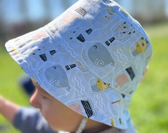 Children's fisherman hat. Light blue double-sided sun hat with fish in a bottle.