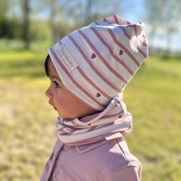 Creamy white hat and neck warmer or scarf for girls with powder pink stripes. Spring hat with red hearts.
