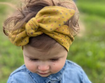 Baby-Mädchen und Baby-Haarband. Verstellbares Haarband mit Schleife.