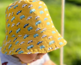 Baby cotton sun hat. Mustard yellow bucket hat with toy cars.