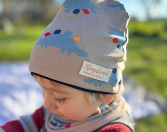 Spring baby hat and neck warmer. Light cotton hat with dinosaurs for children.