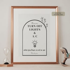 Puede incluir: Un cartel imprimible con un diseño en blanco y negro. El cartel dice "Por favor, apague las luces y el aire acondicionado cuando se vaya o no lo use. Gracias." El cartel está enmarcado en un marco dorado.