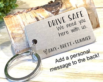 May include: Silver keychain with a metal tag that reads "DRIVE SAFE We need you here with us. AMY BRETT SUMMER" and has space to add a personal message on the back.