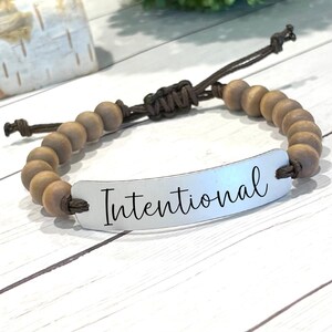 Engraved Word Bracelet: Aluminum Mantra, Wood Bead Adjustable Cord