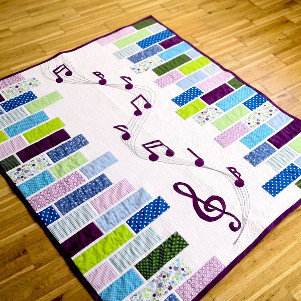 Sound of Music - a modern applique quilt pattern for Music lovers. With Music key and note applique. From a baby to a king size quilt.