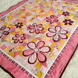 Flower quilt pattern Blooming Meadow, a fresh, modern and scrappy baby girl quilt. PDF instant digital download