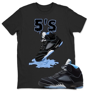 May include: A black short-sleeve t-shirt featuring a graphic of a black and light blue high-top sneaker stepping into a light blue puddle. Above the sneaker, the text 5'S is printed in a dripping light blue font with a black outline.