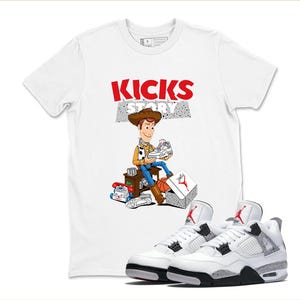 May include: White t-shirt with the text "KICKS STORY" and a cartoon of Woody from Toy Story holding a sneaker. A pair of white and grey trainers with black soles are in the foreground.