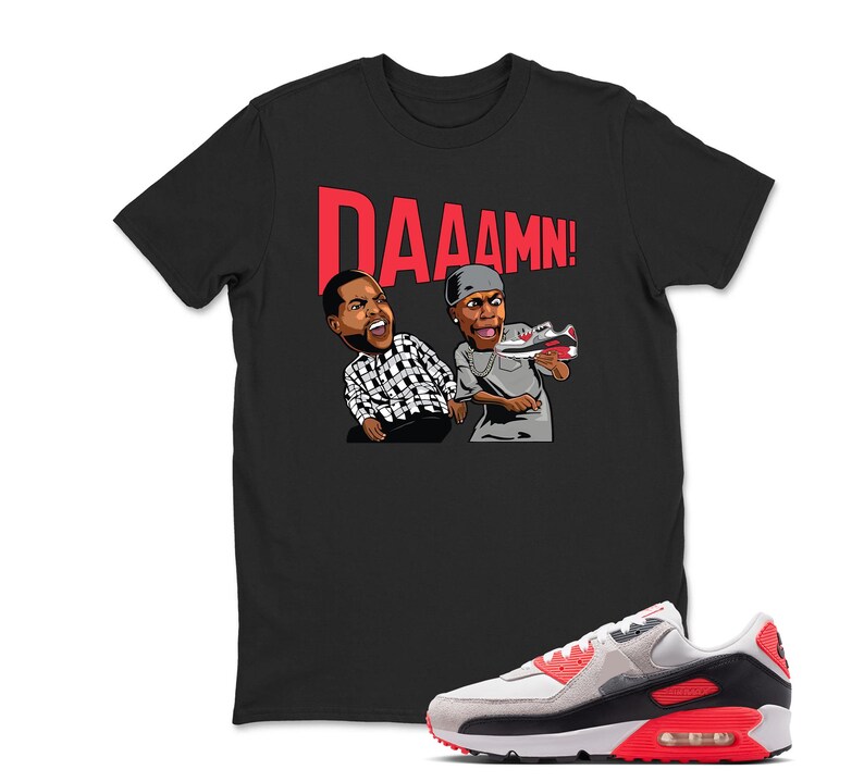 May include: Black t-shirt with a graphic of two cartoon figures and the word "DAAAMN!" in red. A pair of Air Max 90 sneakers in white, gray, black, and red are in the foreground.