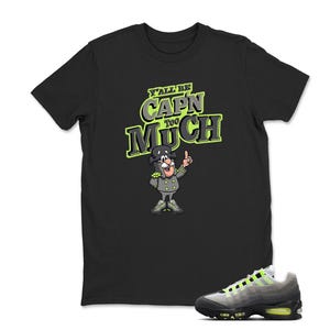 May include: Black t-shirt with a cartoon image of a captain and the text "Y'all Be Capn Too Much" in green and yellow. A gray and black sneaker with neon green accents is in the foreground.