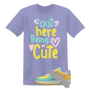 May include: A white ceramic mug with a black handle and the text "But First, Coffee" in a black, handwritten-style font. The mug is on a white surface.