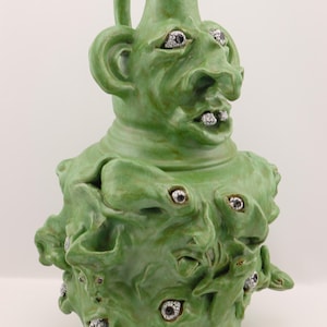 G. L. Howell Green Sculptural Face Jug Vase with Raised Eyes and Lizards