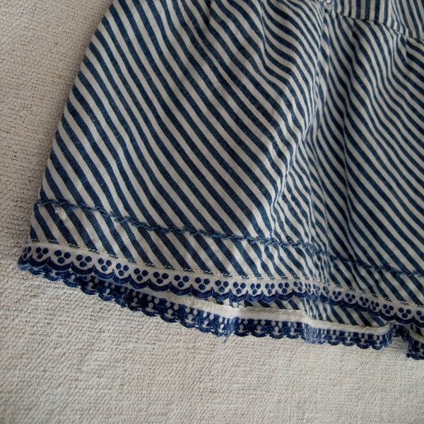 Old cotton skirt with white and blue stripes. Handcrafted in the 1900s.