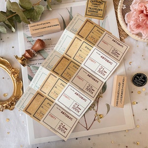 May include: A set of six vintage-style paper labels with a brown and white color scheme. The labels are rectangular and feature the text "АВТОБУС" and a number in Cyrillic script. The labels are designed to look like old bus tickets.