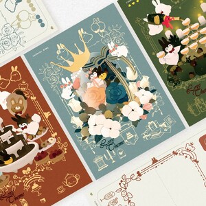 May include: Four different designs of greeting cards with illustrations of animals and flowers. The cards are all in a light blue, pink, and green color scheme. The text on the cards says "Love Chamo".