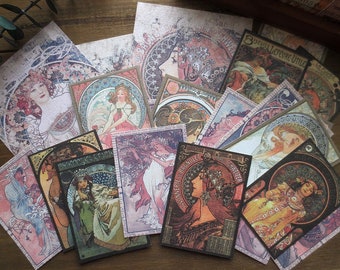 May include: A collection of vintage-style art prints featuring Art Nouveau illustrations of women with flowing hair and floral accents. The prints have a muted color palette with shades of pink, green, and brown, and include French text.
