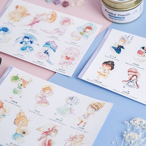 May include: Three sheets of stickers featuring watercolor illustrations of girls wearing different hats and outfits. Each sticker has a name written in Japanese below the illustration.