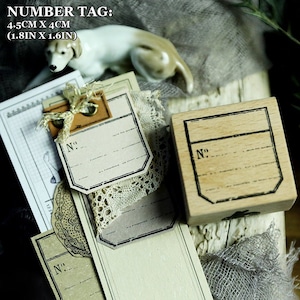May include: A selection of vintage number tags and a wooden stamp. The tags are beige with black borders and the text "N°:". The wooden stamp has a similar design. The tags measure 4.5cm x 4cm (1.8in x 1.6in).