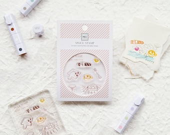 May include: A set of clear acrylic stamps with illustrations of food and drink. The stamps are arranged in a grid pattern on a white background. The text "Spice Stamp" is printed on the card.