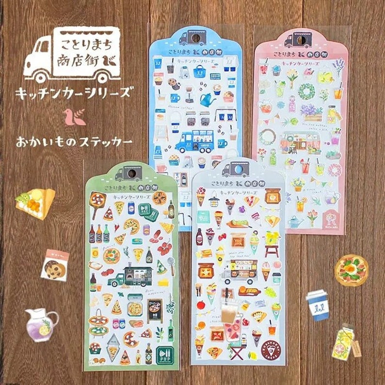 May include: Four sheets of stickers featuring illustrations of food trucks selling various items like pizza, ice cream, coffee, and flowers. The stickers are labeled "Kitchen Car Series" and "Kotori Machi Shop".