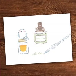 May include: A white bird perched on top of a clear glass bottle with a yellow liquid inside. Next to it is a green bottle with a brown stopper and the text "wakobairo". A blue and white calligraphy pen is drawn with a dotted line.