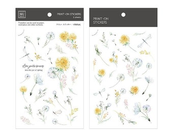 May include: Two sheets of print-on stickers featuring watercolor illustrations of dandelions, dragonflies, and other wildflowers. The stickers are on a white background and have the text "Like gentle breeze into the joy of spring" printed on one sheet.