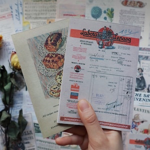 May include: Two vintage paper ephemera cards. One card features a recipe for a sweet bread with a lace doily and a handwritten note. The other card is a receipt from Laboratoires Lepasq, Lyon, France, dated July 22, 1939.