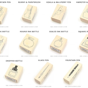 May include: Set of 10 wooden stamps featuring various animal and writing utensil designs. The stamps are approximately 2.8 cm x 4.5 cm x 2.5 cm in size. The designs include a cat with a fountain pen, a bunny with a paintbrush, a koala with a ballpoint pen, a hamster with an ink bottle, a bird with an ink bottle, a round ink bottle, a sealed ink bottle, a square ink bottle, a dropper bottle, a glass pen, and a fountain pen.