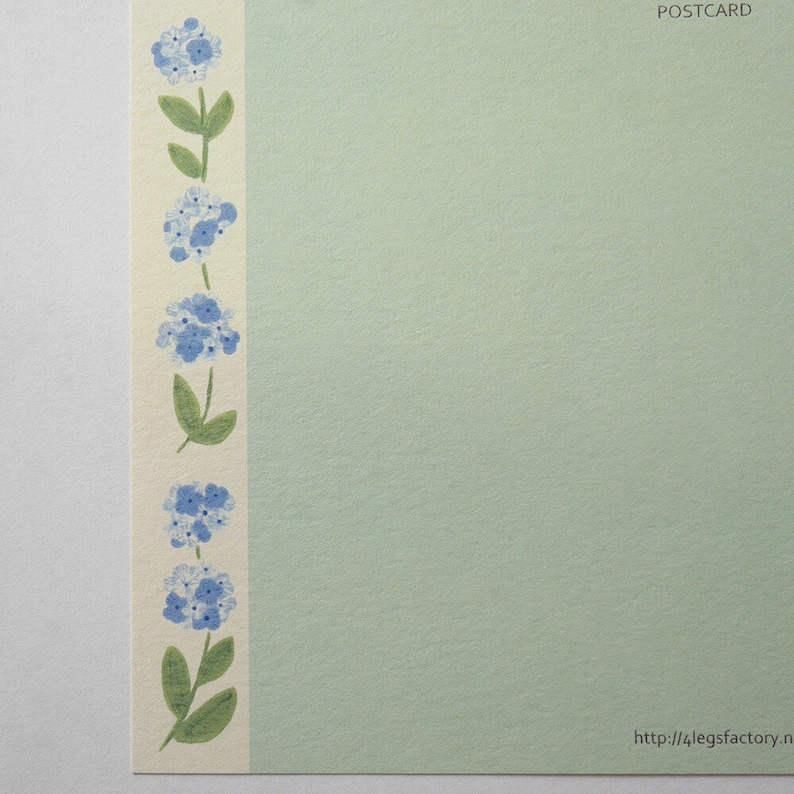 May include: A light green postcard with a border of blue flowers and green stems on the left side. The text "POSTCARD" is in the top right corner. The text "http://4legsfactory.n" is in the bottom right corner.